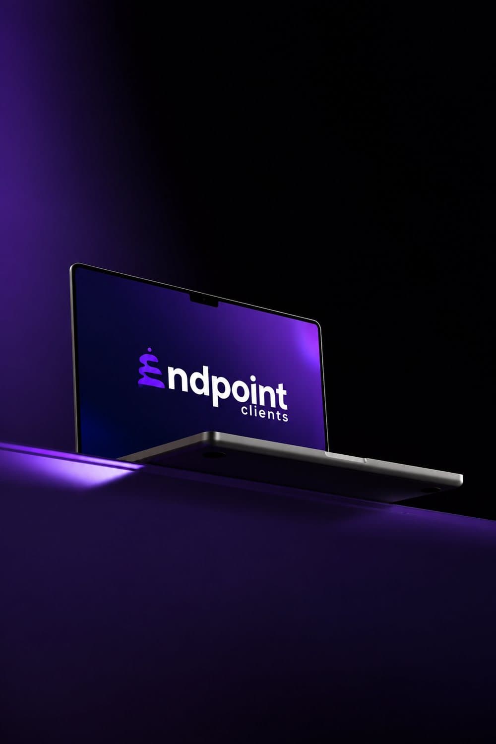 Endpoint Clients logo on a laptop screen, lit in purple